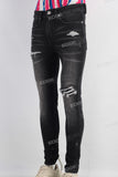 Black damaged skinny jeans