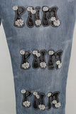 Blue embroidered damaged bell bottom jeans