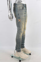 Green vintage damaged skinny jeans