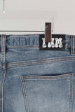 Blue embroidered damaged bell bottom jeans