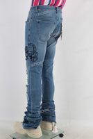 Blue damaged skinny stack jeans