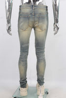 Green vintage damaged skinny jeans