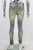 Green vintage damaged skinny jeans