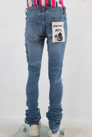Blue damaged skinny stack jeans