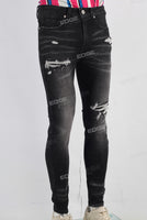 Black damaged skinny jeans