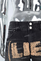 Black screen print jewel on the patch boot cut shorts