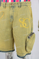 Yellow embroidered boot cut shorts