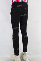 Black skinny damaged denim jeans