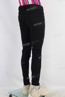 Black skinny damaged denim jeans