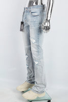 Men's light blue cut and splashed paint distressed washed bell bottoms