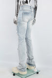 Men's light blue cut and splashed paint distressed washed bell bottoms