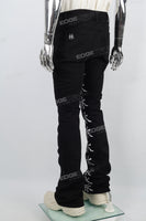 Character embroidered black stacked jeans