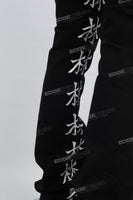 Character embroidered black stacked jeans