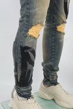 Men's Blue Ripped Jeans with Black Leather Patch