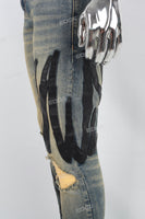 Men's Blue Ripped Jeans with Black Leather Patch