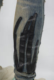 Men's Blue Ripped Jeans with Black Leather Patch