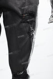 Black waxed and rhinestoned ripped Skinny Jeans