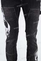 Black embroidered patchwork flared overalls