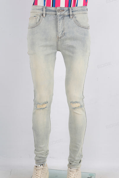 Acid washed damaged skinny jeans