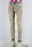 Yellow damaged skinny jeans