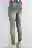Acid washed damaged embroidered skinny jeans