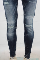 Blue damaged paint splatters skinny jeans