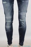 Blue damaged paint splatters skinny jeans