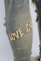 Acid washed damaged embroidered skinny jeans