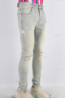 Acid washed damaged skinny jeans