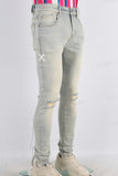 Acid washed damaged skinny jeans