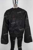 Black oversize and loose waxed jacket