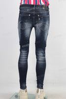 Blue damaged paint splatters skinny jeans