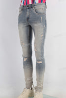 Blue acid washed damaged skinny jeans
