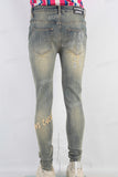 Acid washed damaged embroidered skinny jeans