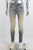 Green vintage damaged skinny jeans