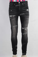 Black damaged skinny jeans