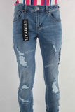 Blue damaged skinny stack jeans