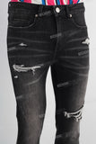Black damaged skinny jeans