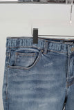 Blue embroidered damaged bell bottom jeans