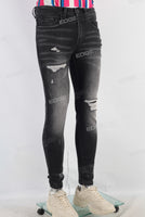 Black damaged skinny jeans