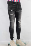 Black damaged skinny jeans