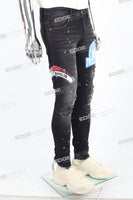 black distressed paint splatters skinny men jeans with screen printed logo