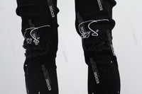 black paint spplatters distressed skinny men jeans with embroidery logo