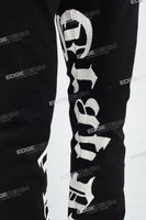 Black Alpha Gothic Logo Print Mans Stack Jeans